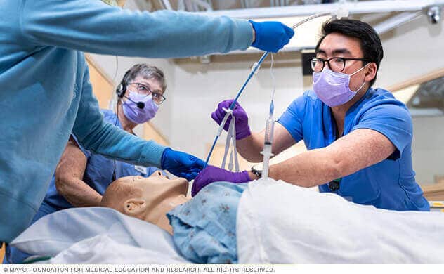 Mayo Clinic Emergency Medicine care providers practice during a simulation.