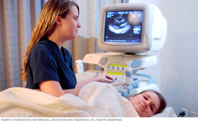 A person does an echocardiogram.