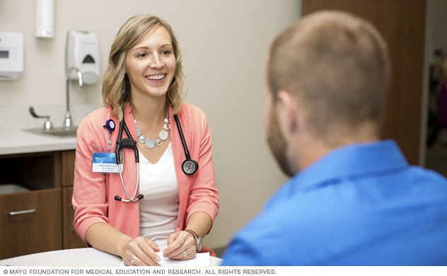 A Mayo Clinic allergy specialist consults with a patient