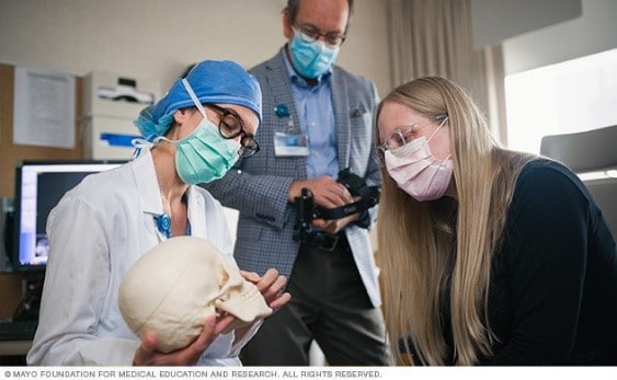 Mayo Clinic Ophthalmologists explain a procedure to a patient.
